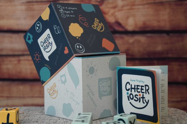 Cheeriosity coffee packaging with playful design and mug.