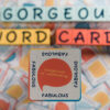 A word card with the word 'FABULOUS' surrounded by colorful letter tiles.