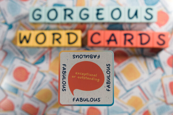 A word card with the word 'FABULOUS' surrounded by colorful letter tiles.