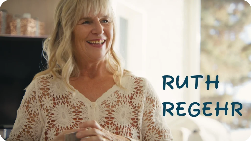 Smiling woman in a cozy knit sweater with text beside her.